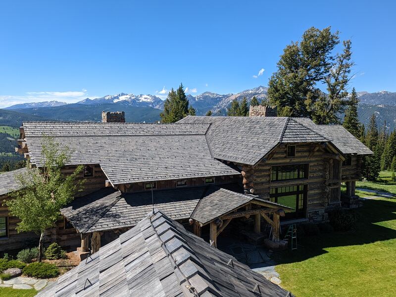 Cedar shake log estate with Lone Peak backdrop